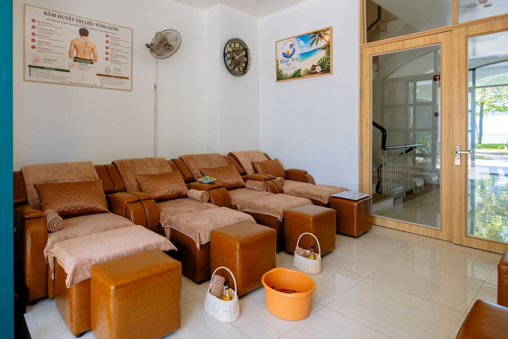 Reclining chairs in the bright foot massage room